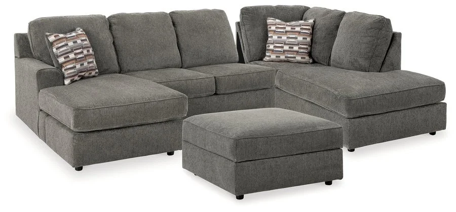 Contemporary putty-colored sectional with dual chaise seating, soft chenille upholstery, and coordinating accent pillows.