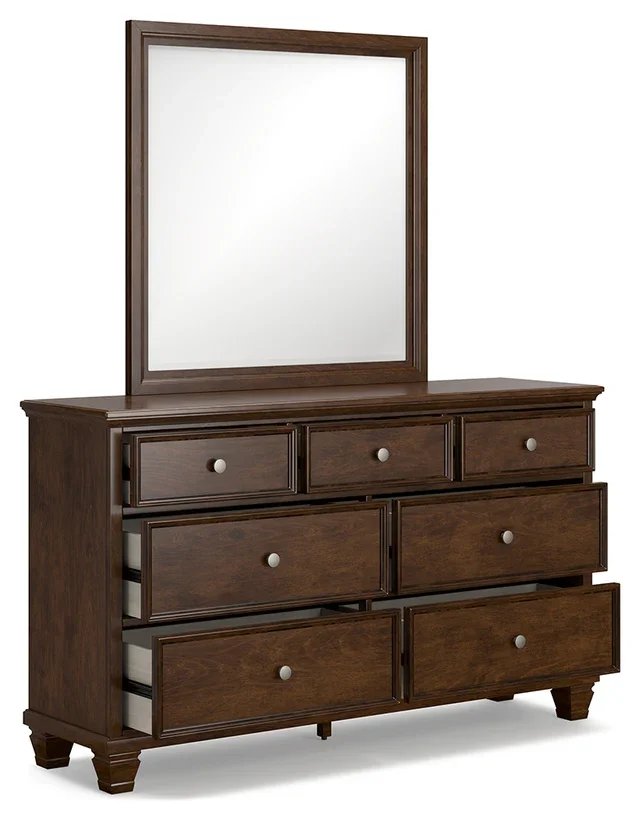 Seven-drawer cherry dresser with a matching framed mirror, dovetail drawers, and satin nickel-tone hardware.