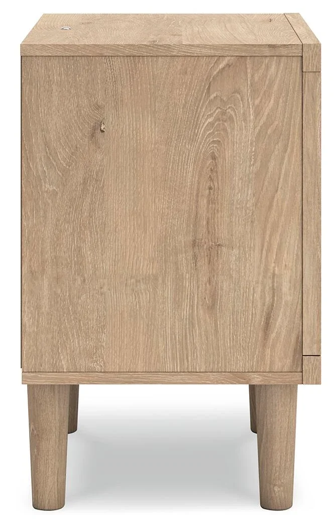 Modern one-drawer nightstand with a light oak finish, cane-inspired drawer front, built-in LED lighting, USB ports, and wireless charging.