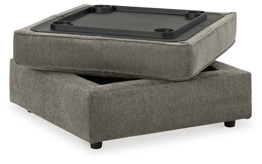 Matching upholstered storage ottoman with removable lid, plush cushioning, and hidden storage compartment.