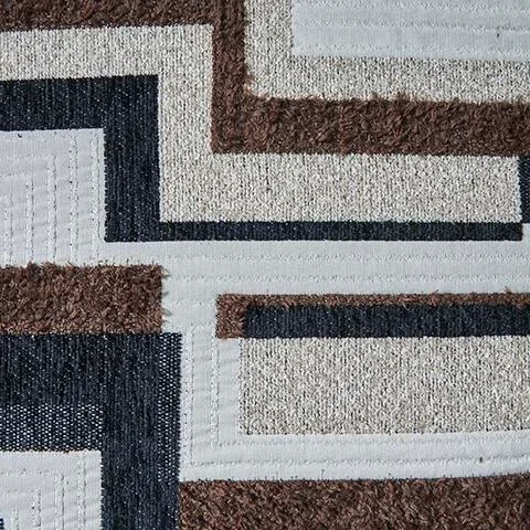 Close-up of the Monarch sectional showcasing the jumbo corduroy fabric, plush cushions, accent pillows, and quality craftsmanship.
