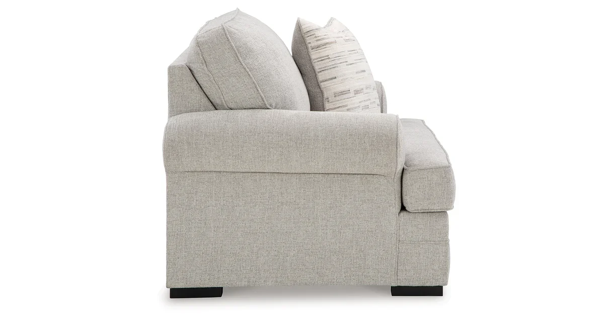 Oversized upholstered chair with textured polyester fabric, reversible seat cushion, plush accent pillow, and supportive foam cushioning.