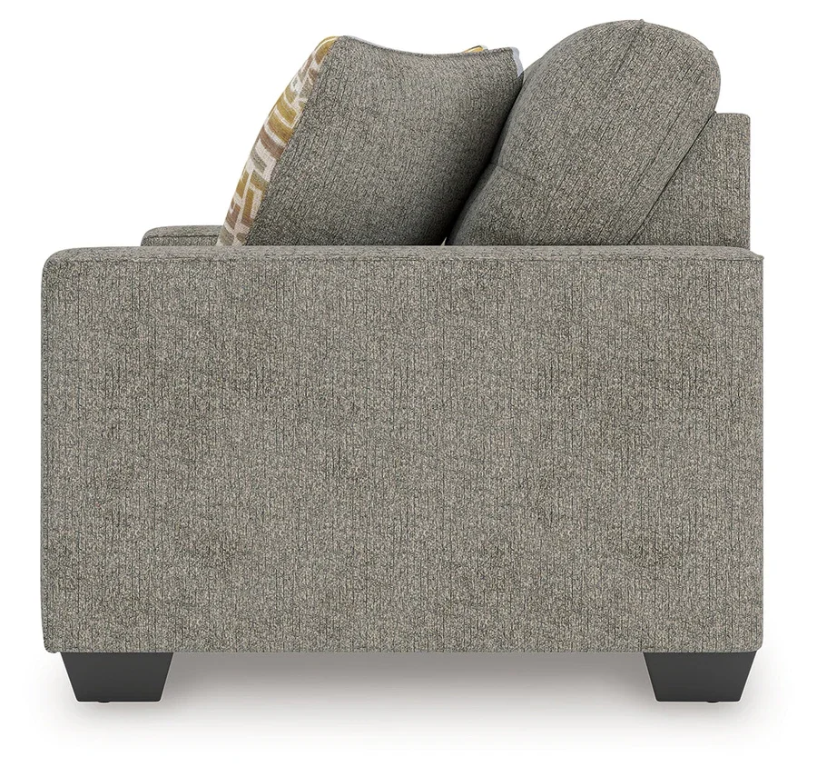 Matching transitional loveseat with track arms, soft polyester upholstery, plush cushions, and coordinating accent pillows.