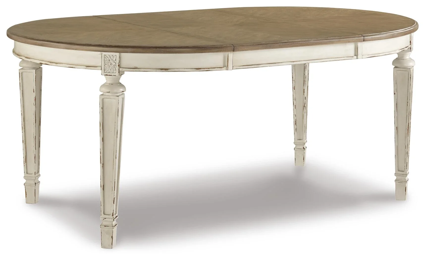 French country oval extension dining table with a distressed wood top, chipped white base, and removable drop-in leaf.