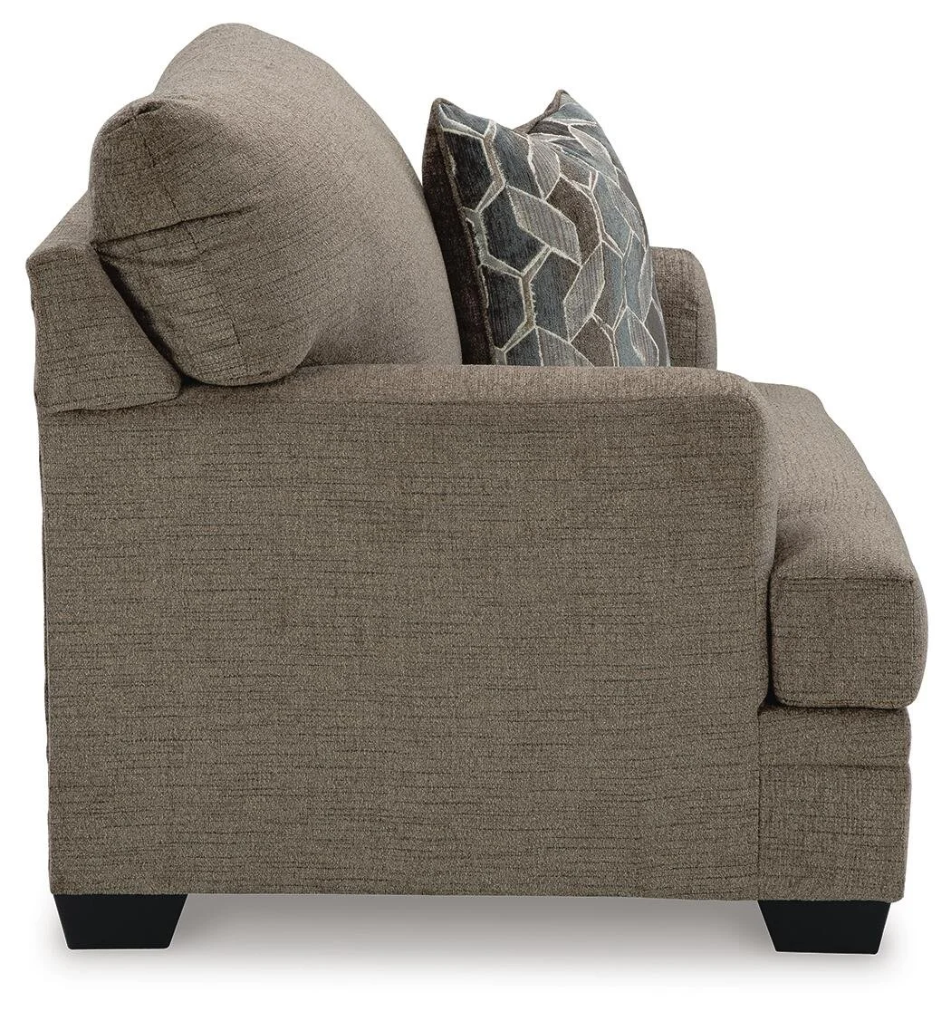 Oversized upholstered accent chair with soft polyester fabric, reversible seat cushion, and supportive foam cushioning.
