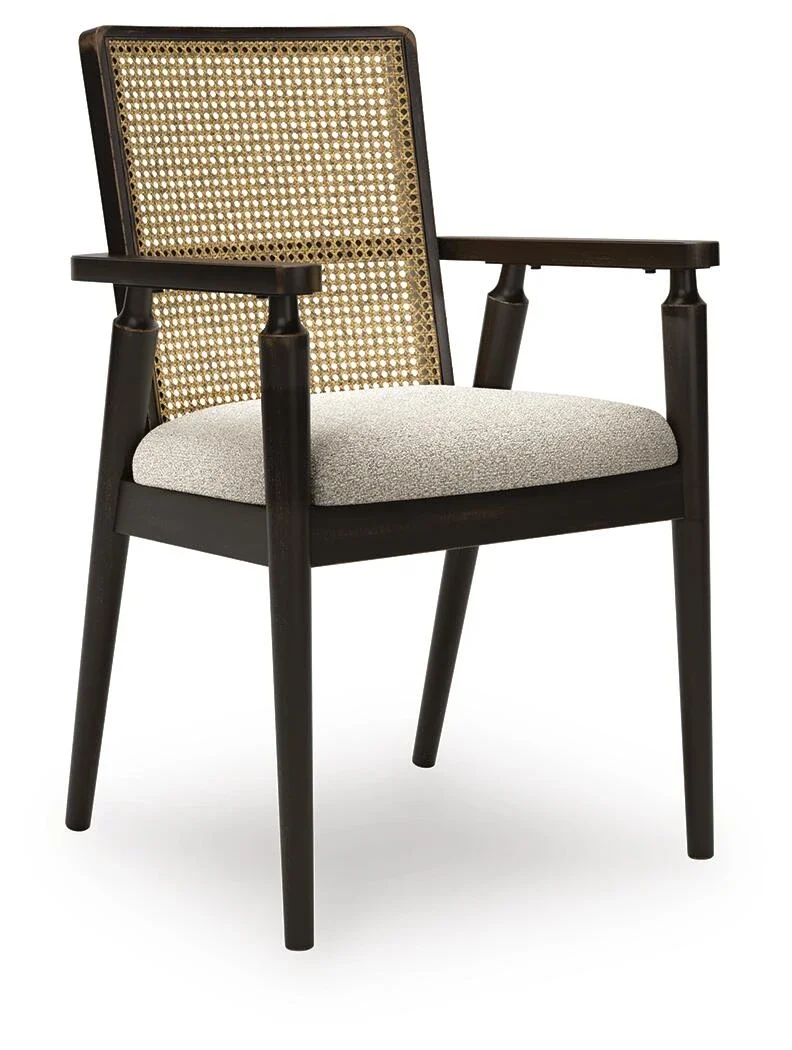 Upholstered dining chair with an aged black wood frame, woven polyester seat, Ratan backing, and clean contemporary styling.