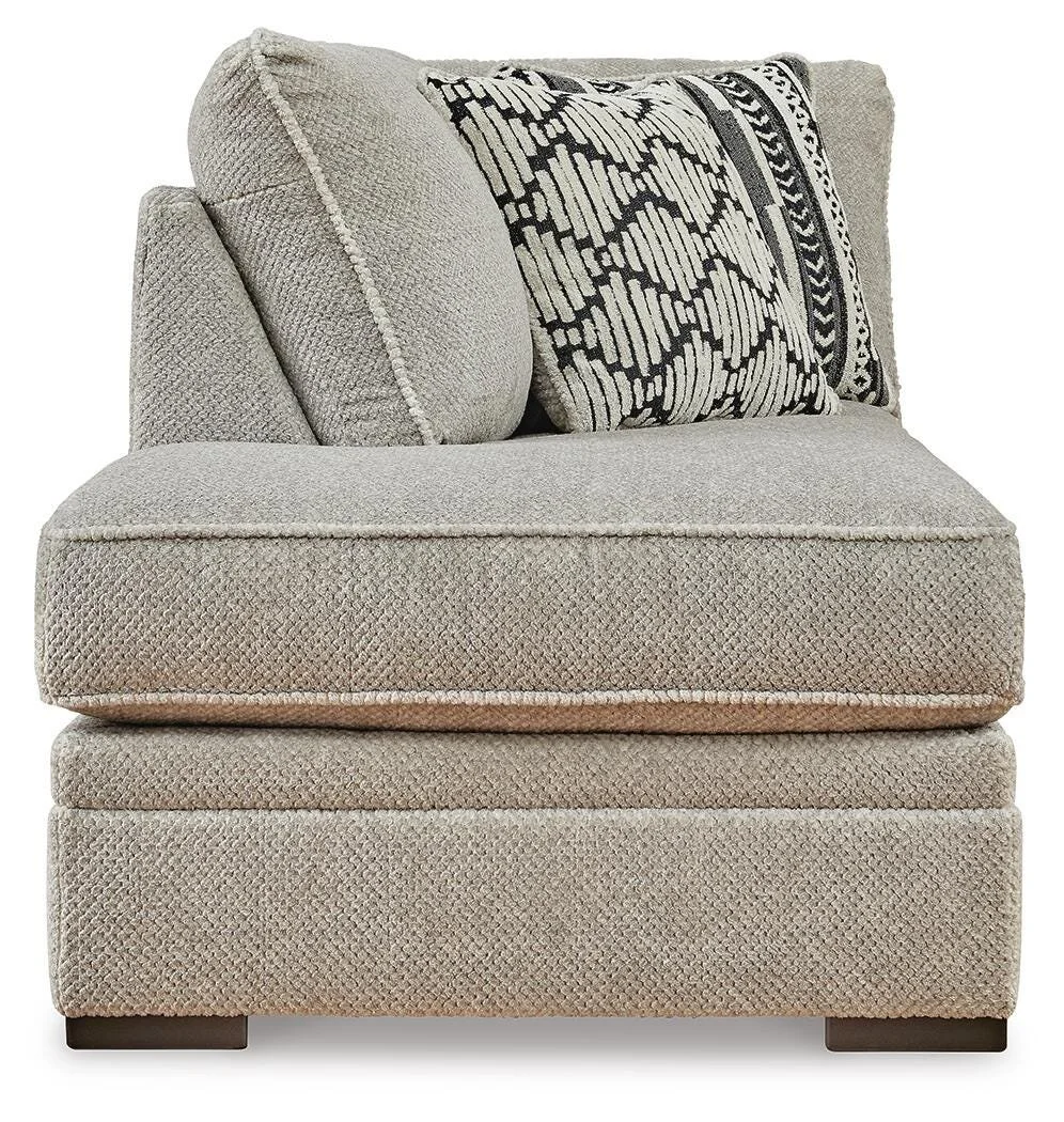 Contemporary dual-chaise sectional with soft polyester upholstery, reversible cushions, plush seating, and coordinating accent pillows.