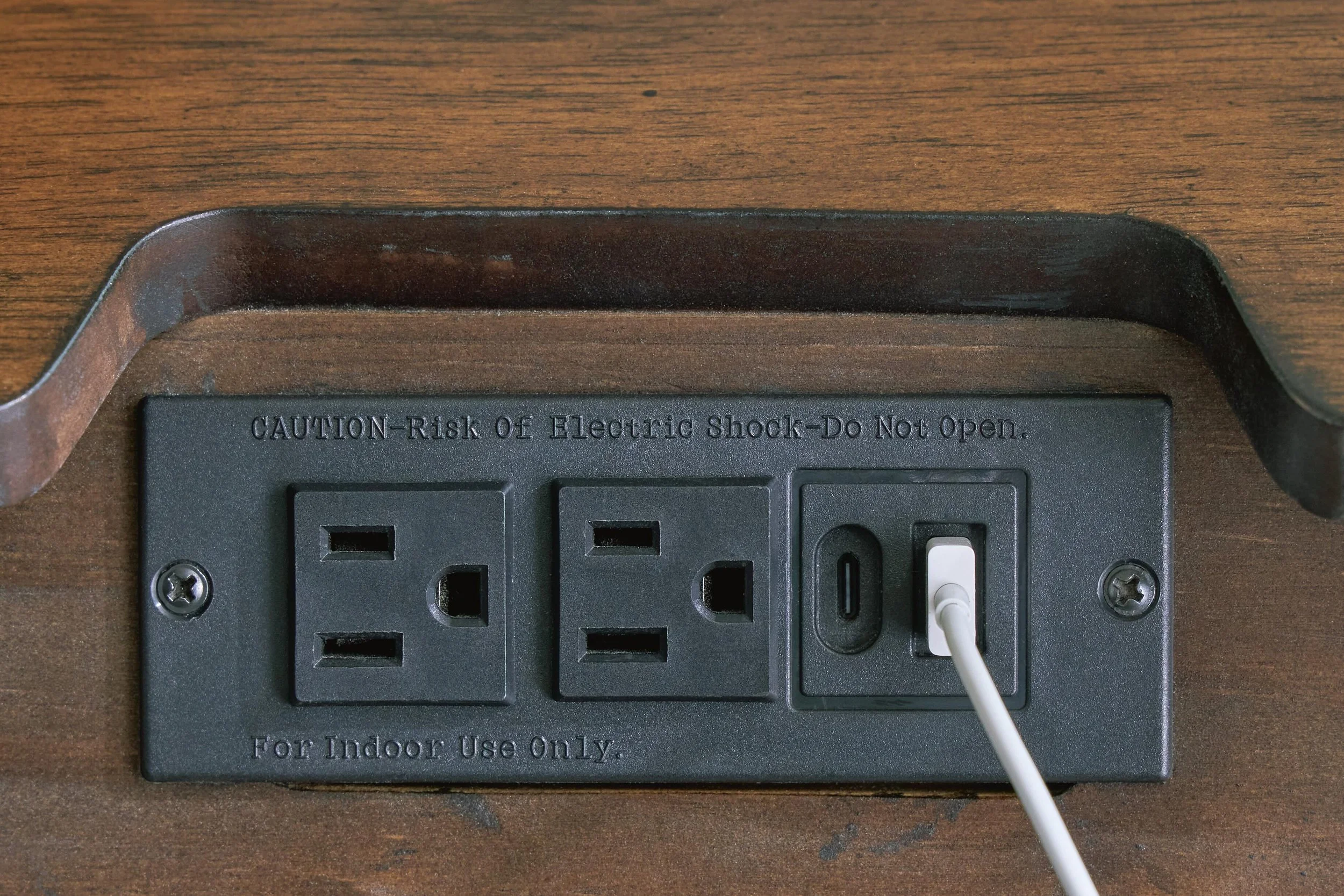Two-drawer nightstand with a medium brown wood finish, built-in power outlet, USB-A and USB-C charging ports, and tapered legs.