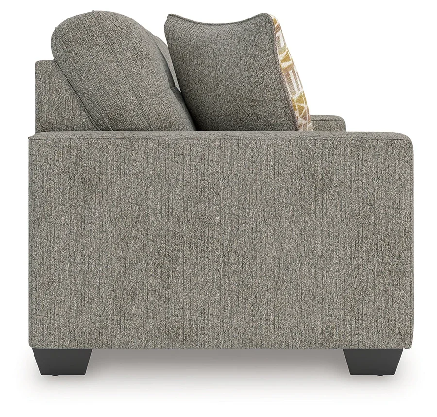 Transitional sofa with track arms, soft neutral polyester upholstery, plush cushions, and coordinating accent pillows.