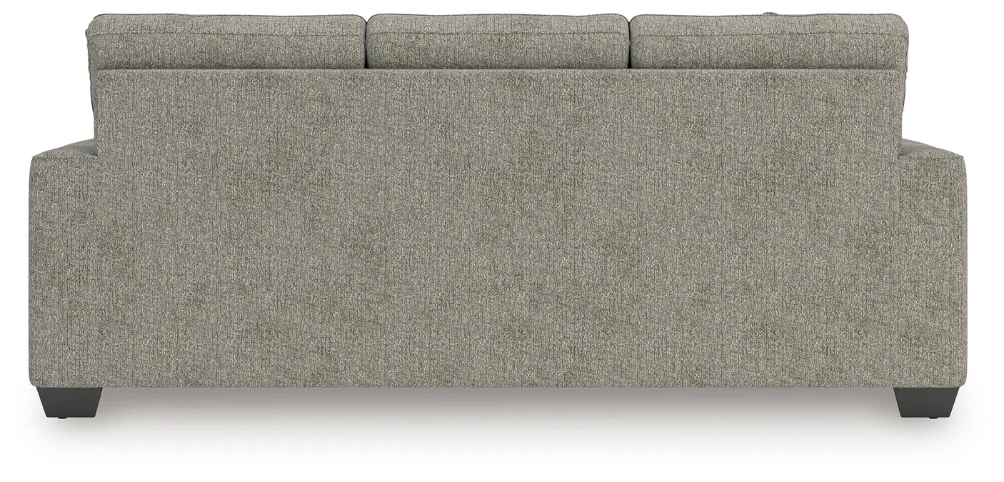 Transitional sofa with track arms, soft neutral polyester upholstery, plush cushions, and coordinating accent pillows.