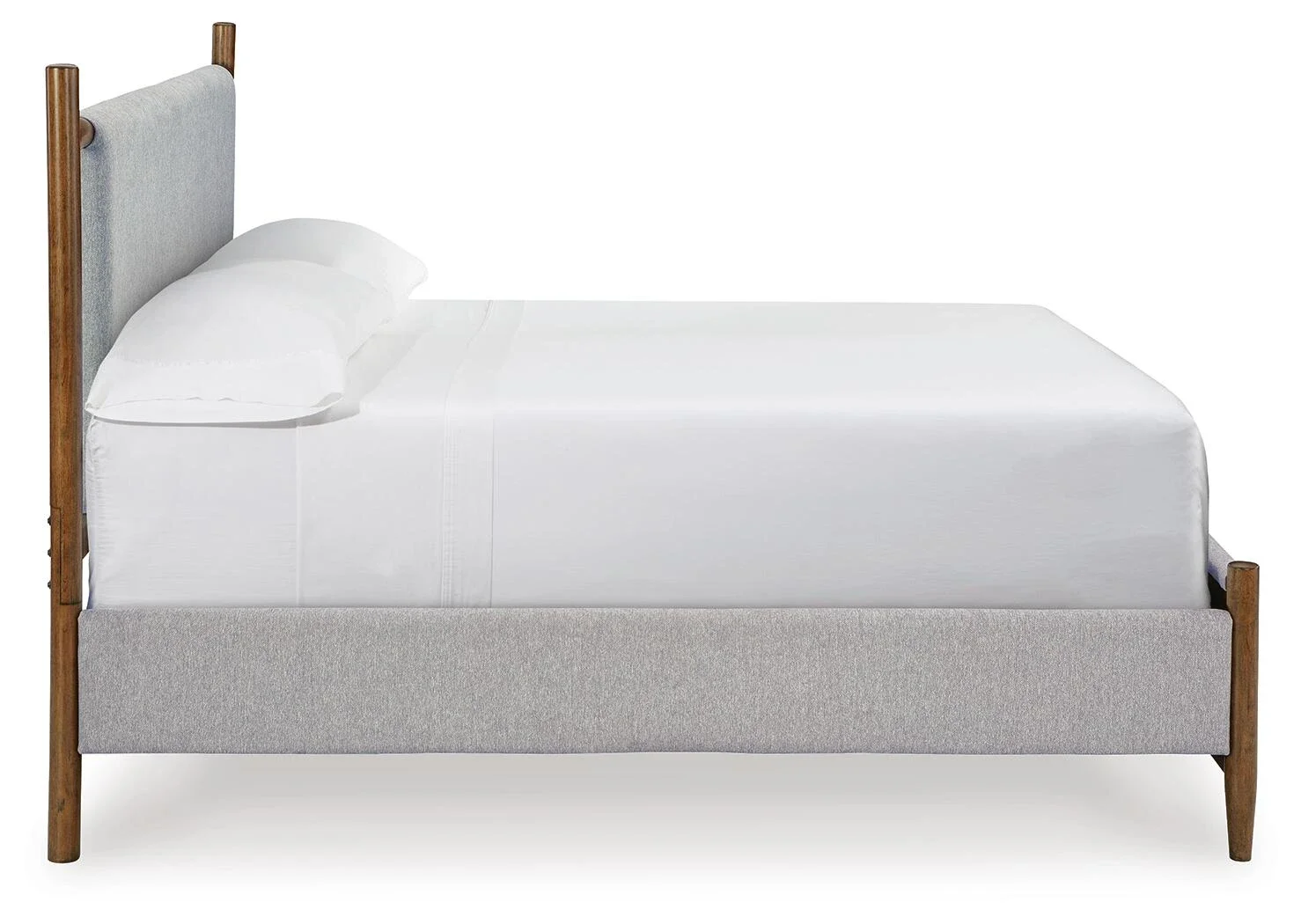 Mid-century upholstered panel bed with a warm medium brown wood finish, soft fabric upholstery, and tapered wood legs.