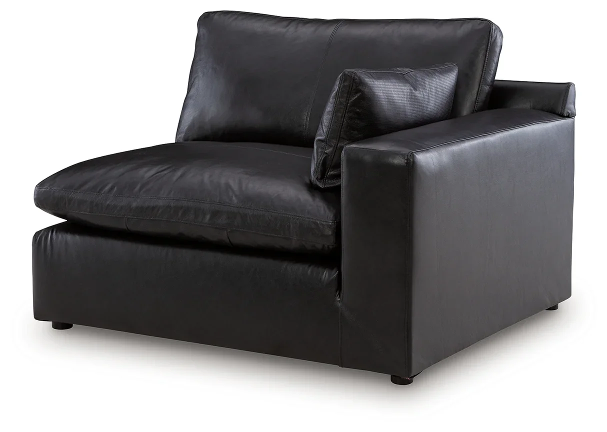 Contemporary modular loveseat with top-grain leather seating, feather-fiber cushions, bolster pillows, and two-piece modular design.