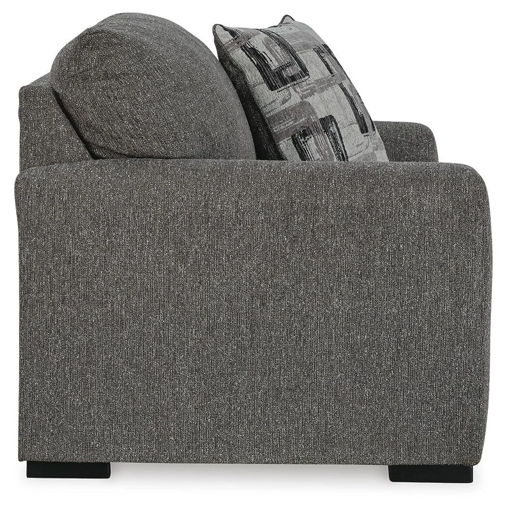 Contemporary oversized upholstered chair with soft polyester fabric, reversible seat cushion, plush accent pillows, and supportive foam cushioning.