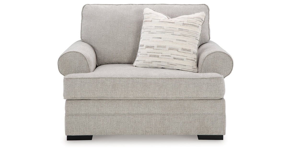 Oversized upholstered chair with textured polyester fabric, reversible seat cushion, plush accent pillow, and supportive foam cushioning.