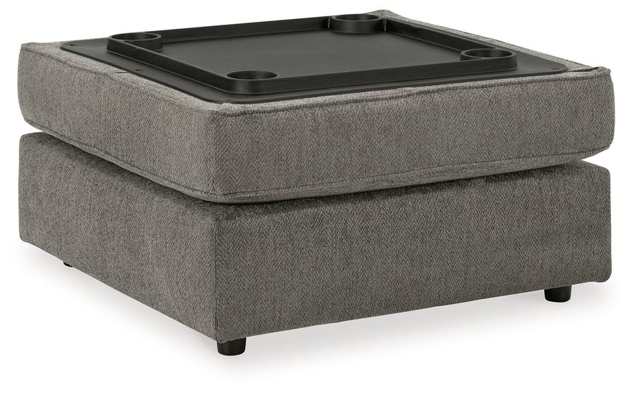 Matching upholstered storage ottoman with removable lid, plush cushioning, and hidden storage compartment.