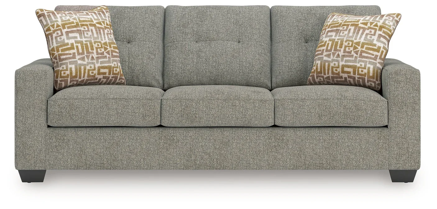 Transitional sofa with track arms, soft neutral polyester upholstery, plush cushions, and coordinating accent pillows.