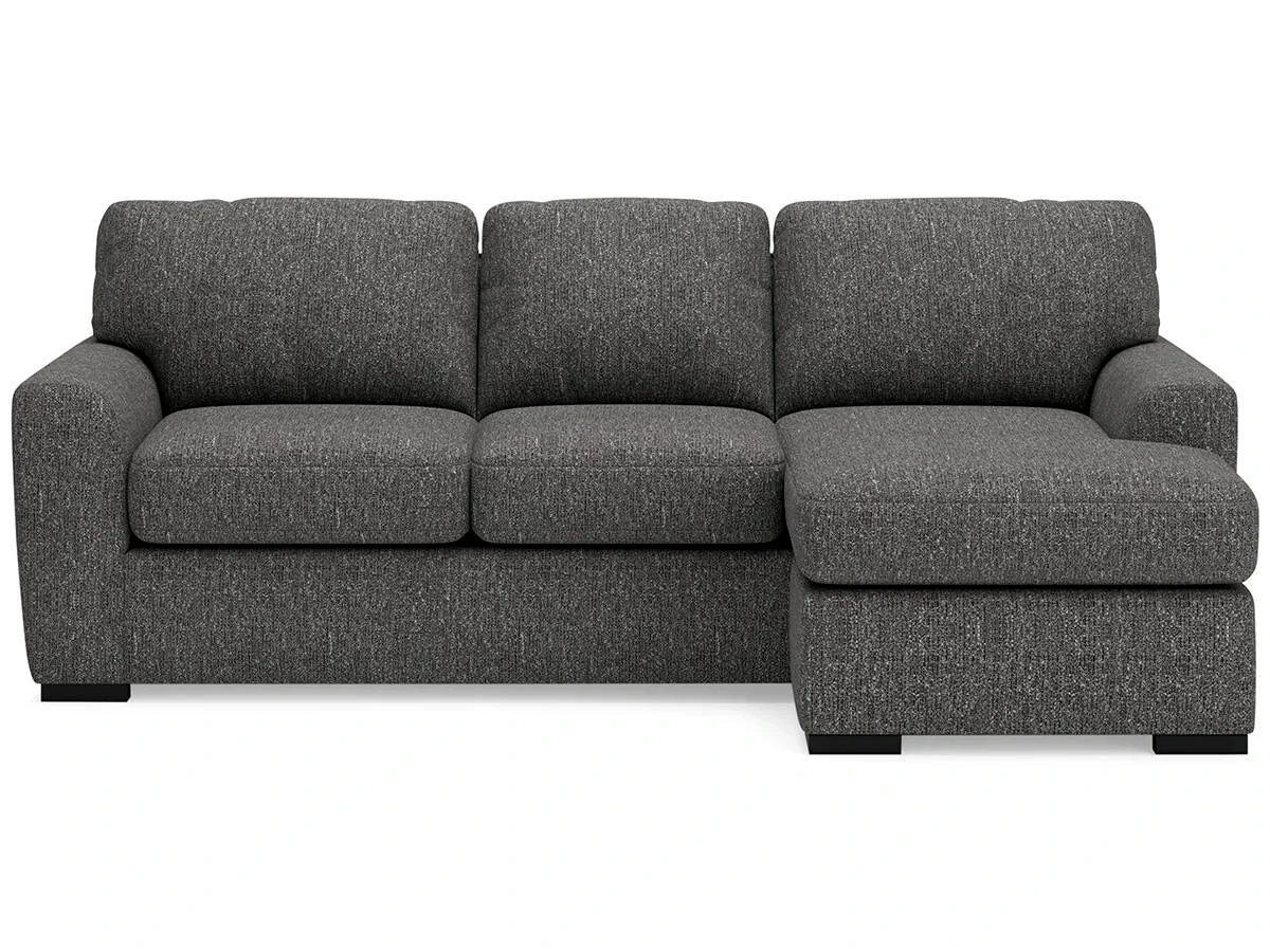Contemporary reversible sofa chaise with soft polyester upholstery, movable ottoman, plush cushions, and oversized seating.