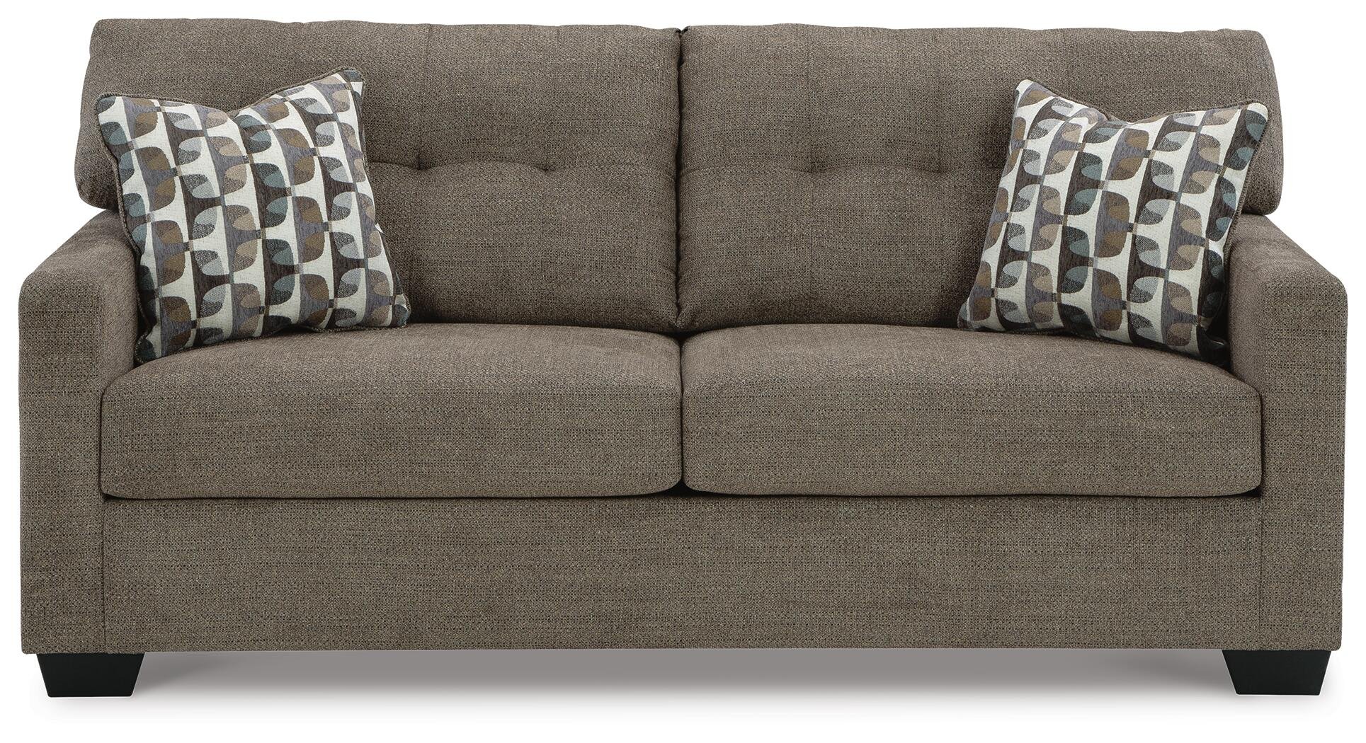 Transitional sofa with tufted back cushions, soft multi-toned polyester upholstery, plush seating, and coordinating accent pillows.