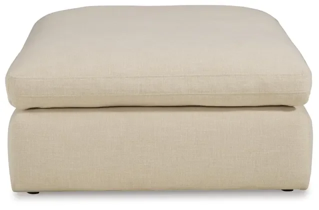 Matching oversized upholstered ottoman with plush cushioning and contemporary styling.
