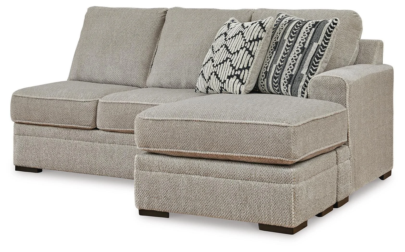 Contemporary dual-chaise sectional with soft polyester upholstery, reversible cushions, plush seating, and coordinating accent pillows.