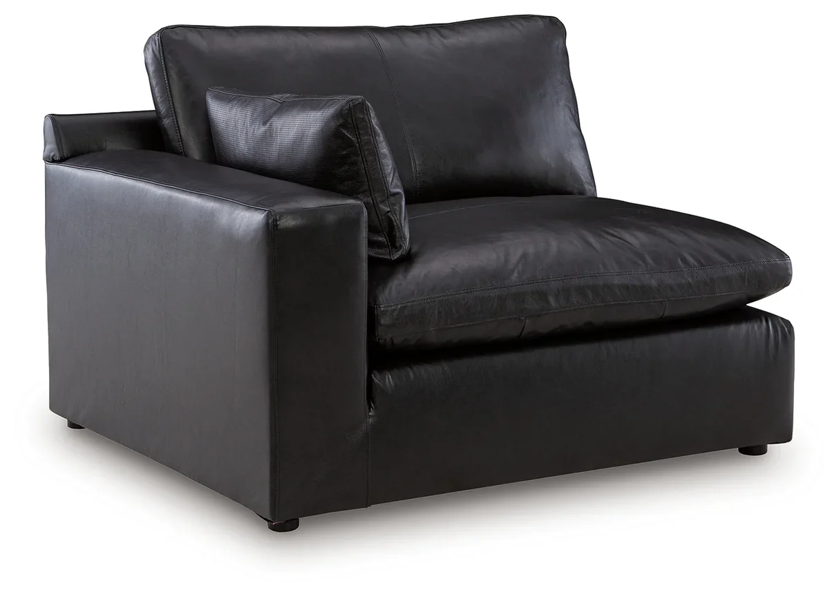 Contemporary modular loveseat with top-grain leather seating, feather-fiber cushions, bolster pillows, and two-piece modular design.