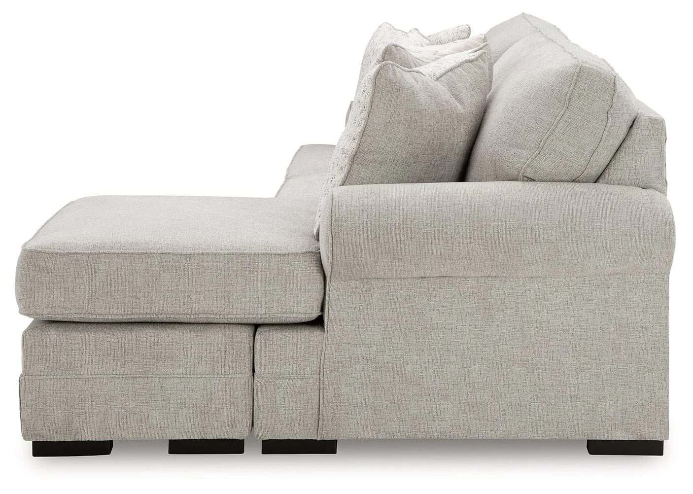 Modern reversible sofa chaise with textured polyester upholstery, movable ottoman, plush cushions, and contemporary styling.