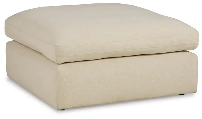 Matching oversized upholstered ottoman with plush cushioning and contemporary styling.