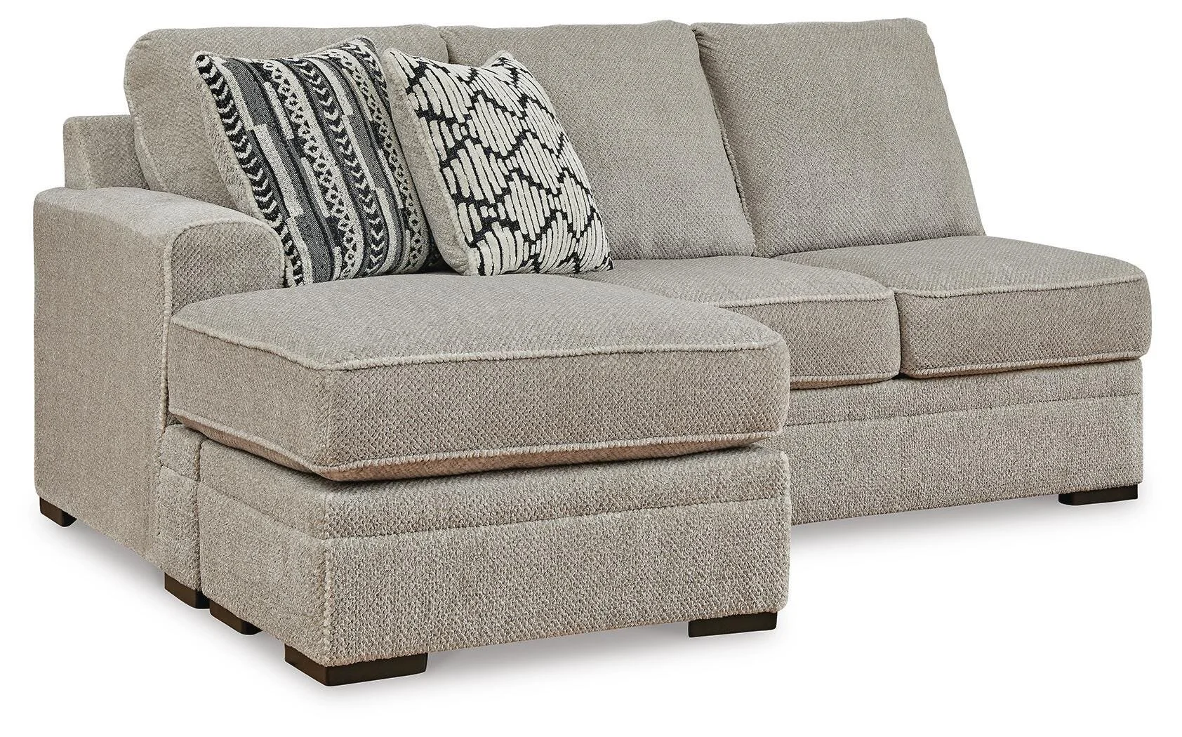 Contemporary dual-chaise sectional with soft polyester upholstery, reversible cushions, plush seating, and coordinating accent pillows.