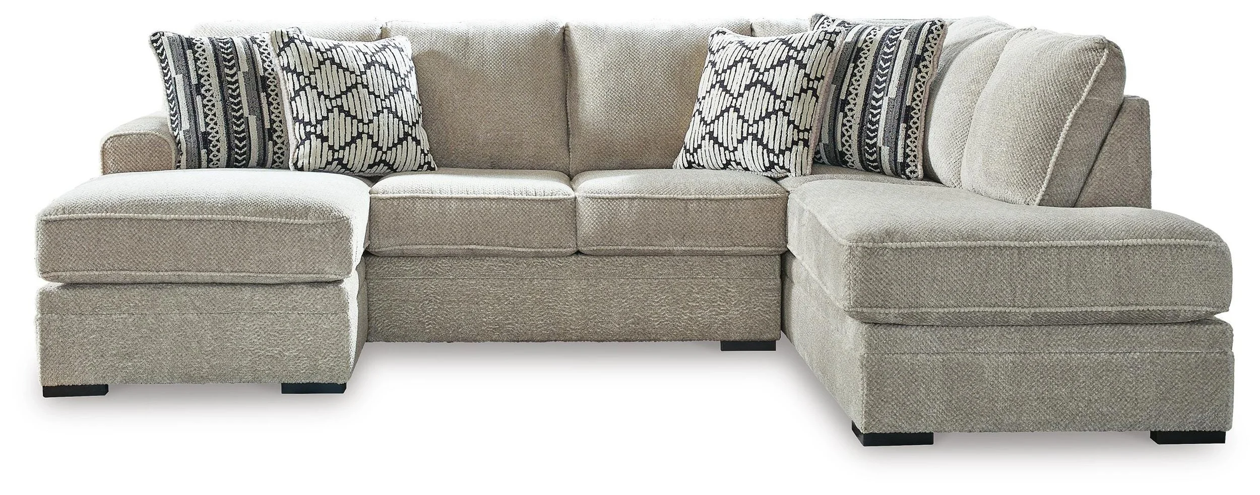Contemporary dual-chaise sectional with soft polyester upholstery, reversible cushions, plush seating, and coordinating accent pillows.