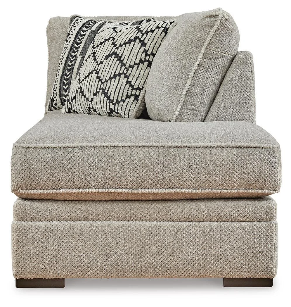 Contemporary dual-chaise sectional with soft polyester upholstery, reversible cushions, plush seating, and coordinating accent pillows.