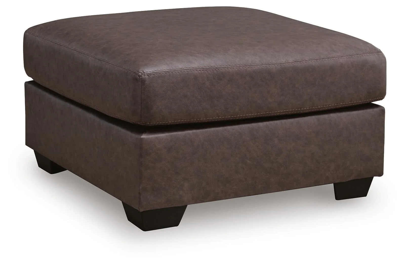 Matching oversized faux leather ottoman with plush cushioning and contemporary styling.