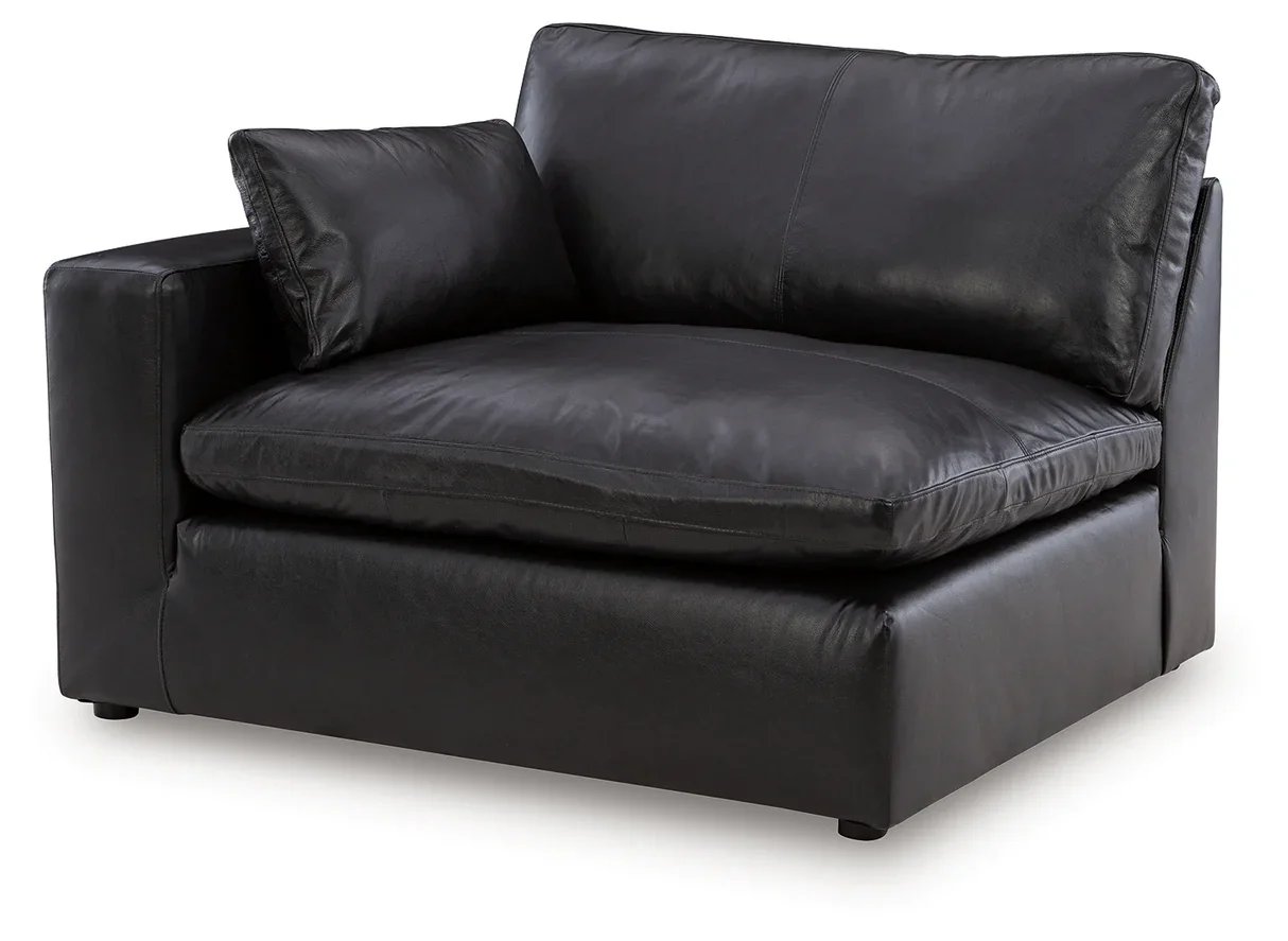 Contemporary modular loveseat with top-grain leather seating, feather-fiber cushions, bolster pillows, and two-piece modular design.