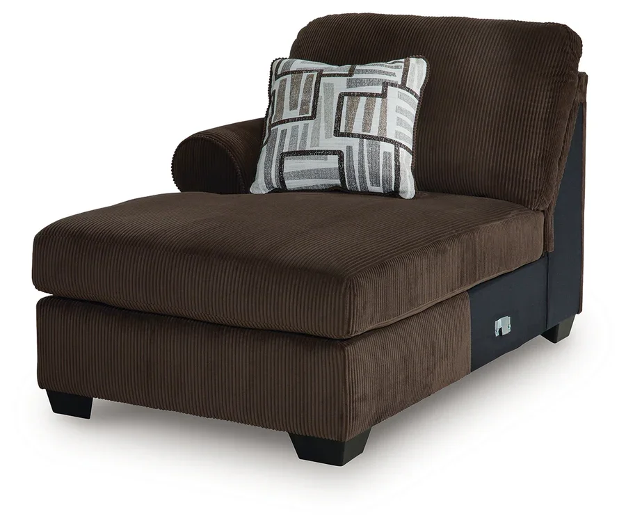 Close-up of the Kingston sectional showcasing the soft corded polyester upholstery, plush cushions, accent pillows, and quality craftsmanship.