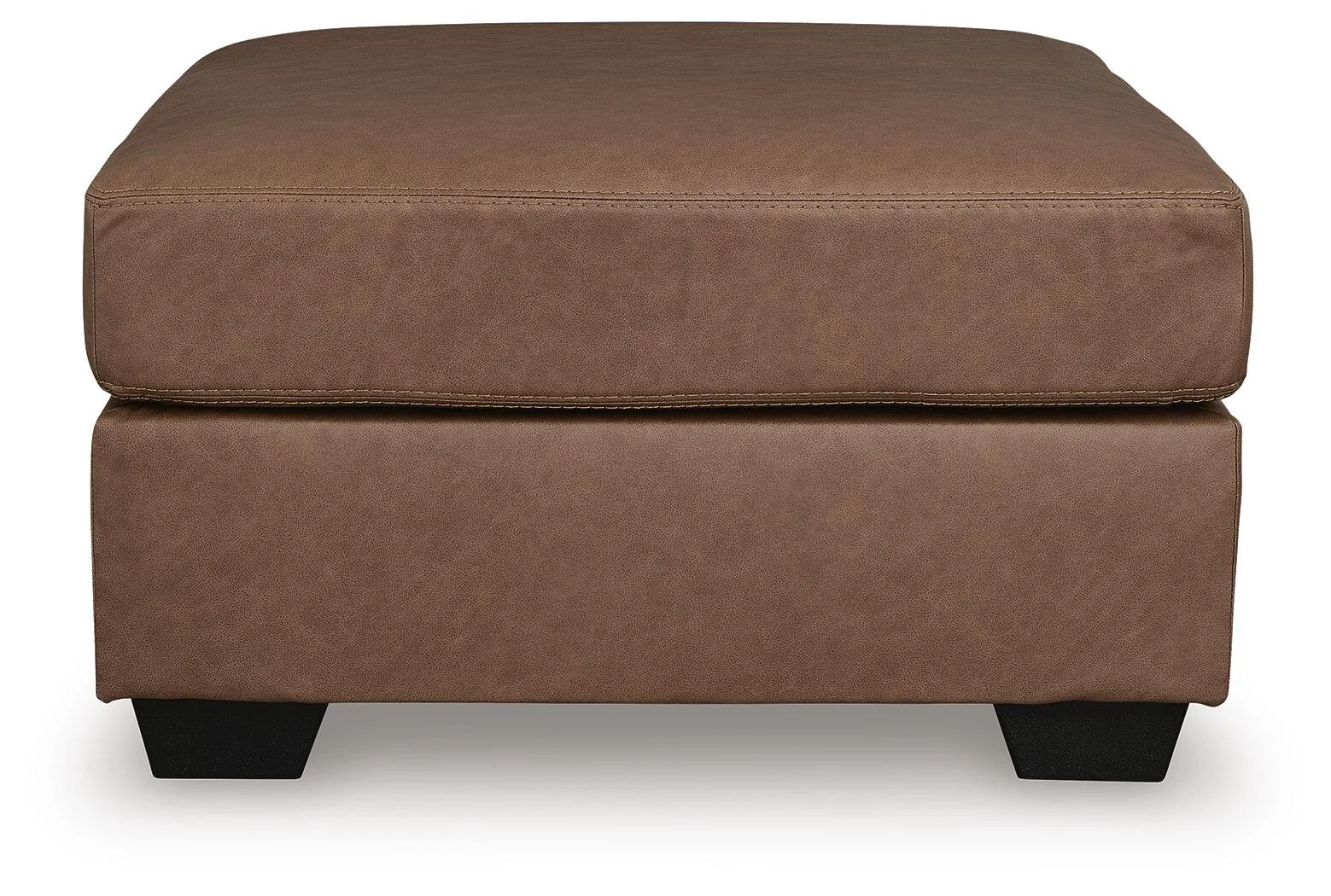 Matching oversized faux leather ottoman with plush cushioning and contemporary styling.