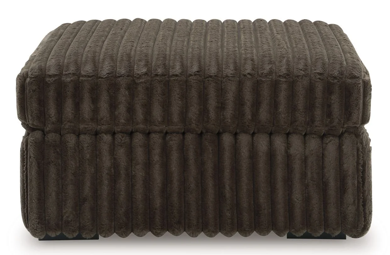 Matching oversized upholstered ottoman with jumbo corduroy fabric, plush cushioning, and contemporary styling.
