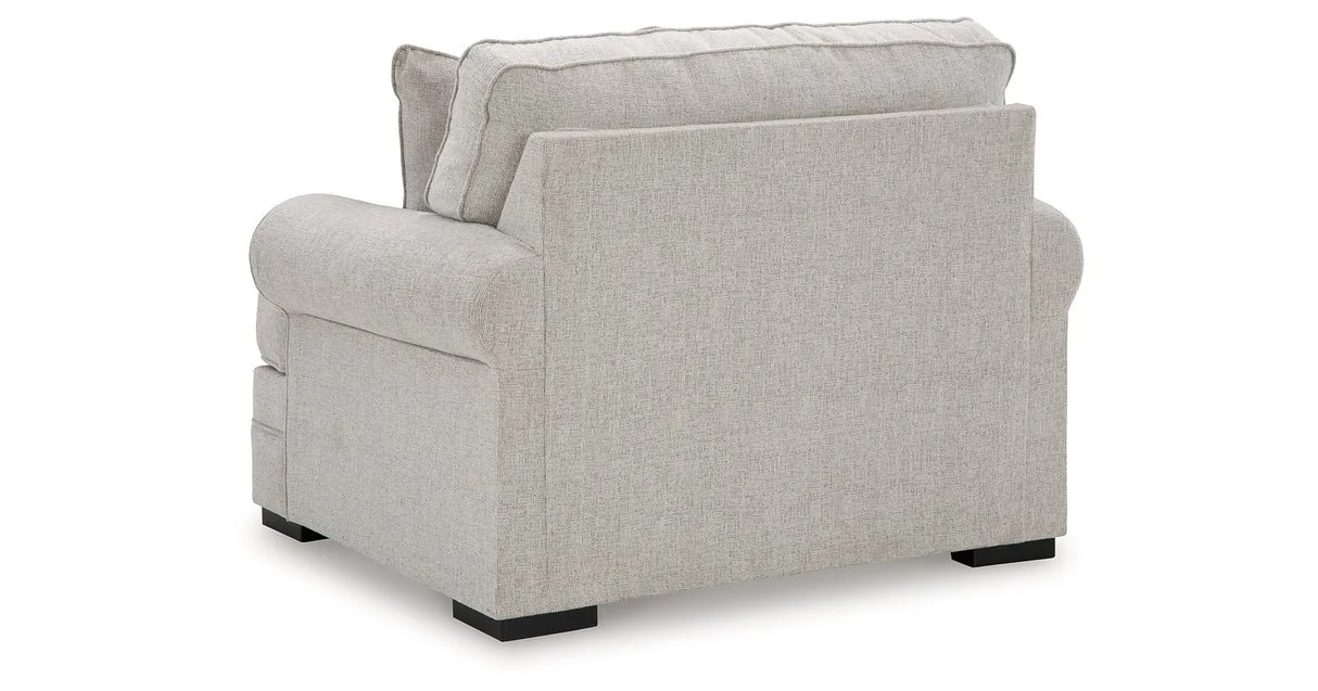Oversized upholstered chair with textured polyester fabric, reversible seat cushion, plush accent pillow, and supportive foam cushioning.