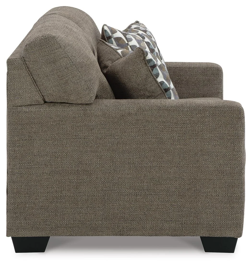 Matching transitional loveseat with tufted back cushions, soft polyester upholstery, plush seating, and coordinating accent pillows.