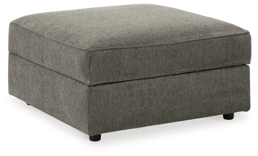 Matching upholstered storage ottoman with removable lid, plush cushioning, and hidden storage compartment.