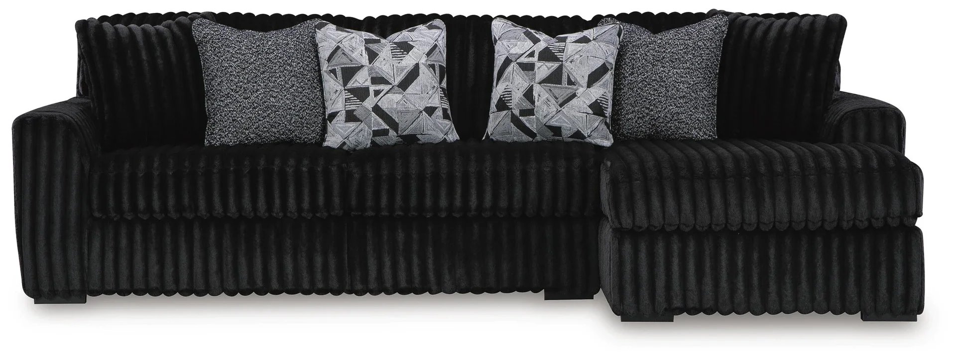 Oversized contemporary sectional with chaise featuring jumbo corduroy upholstery, reversible seat cushions, and plush seating.