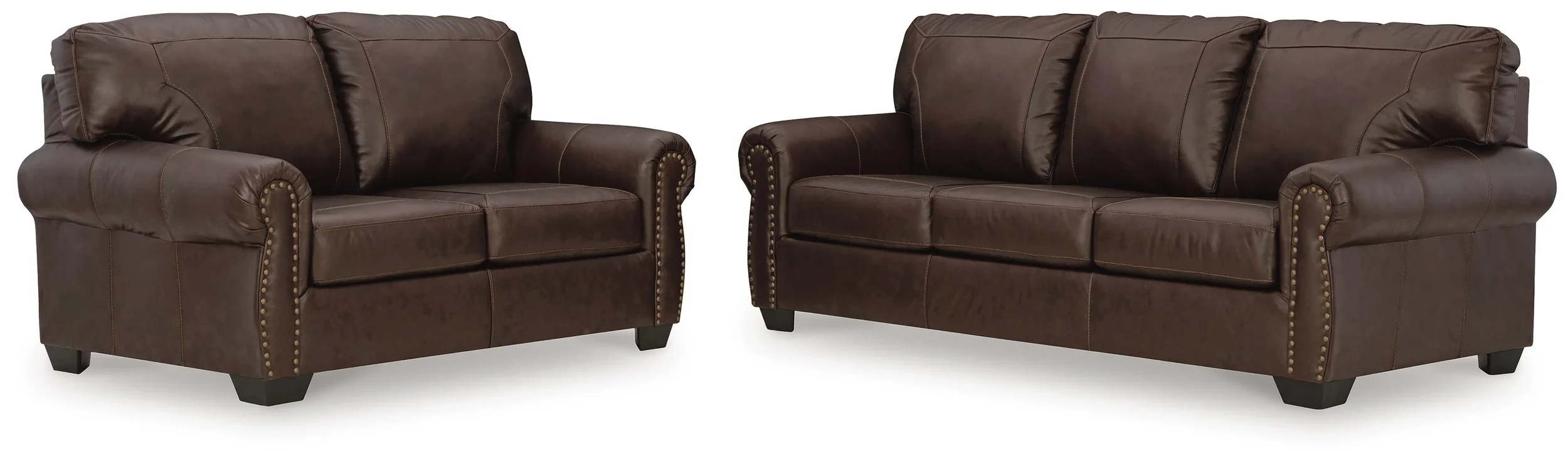 Charleston leather sofa collection on a white background featuring a leather sofa and matching loveseat.
