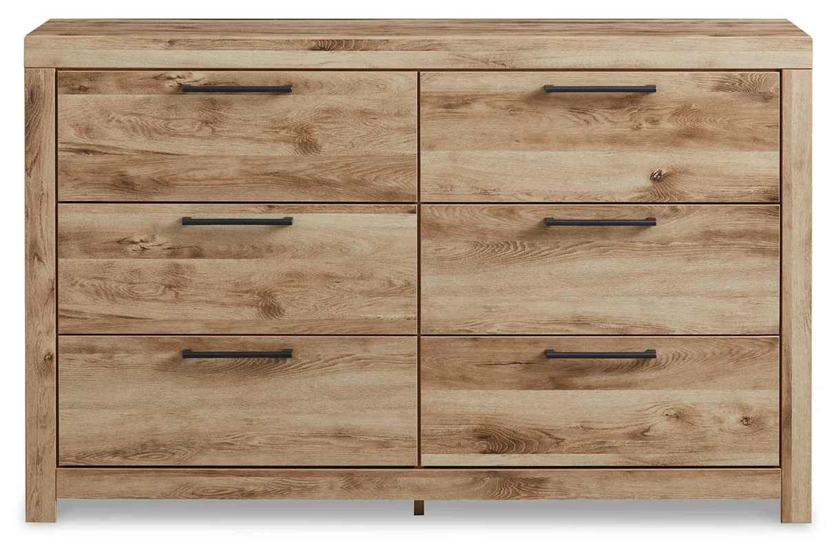 Six-drawer dresser with a matching mirror, golden rustic finish, faux linen-lined drawers, and antiqued gunmetal hardware.