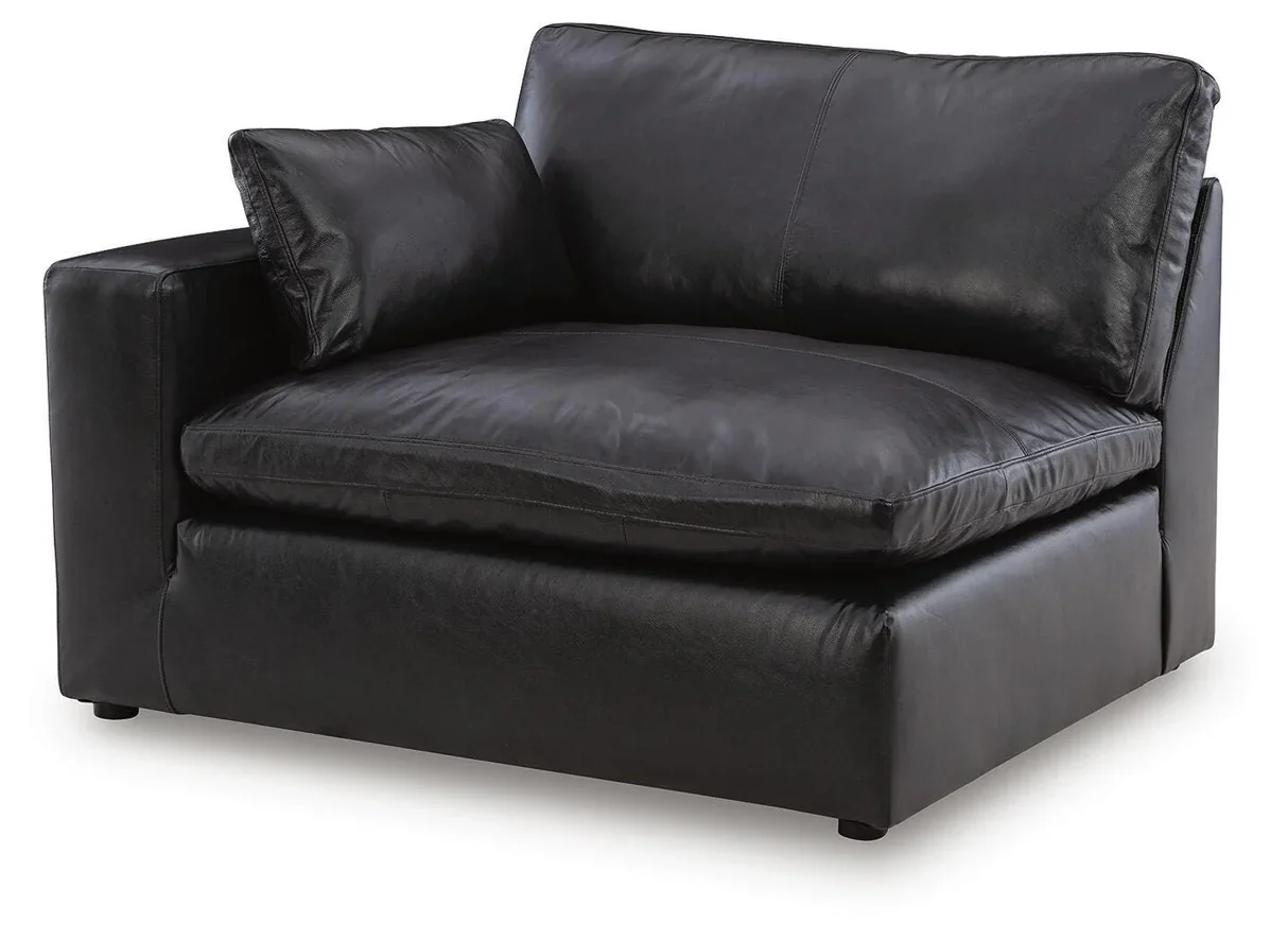 Modern modular leather sofa with top-grain leather seating, feather-fiber cushions, bolster pillows, and flexible three-piece configuration.