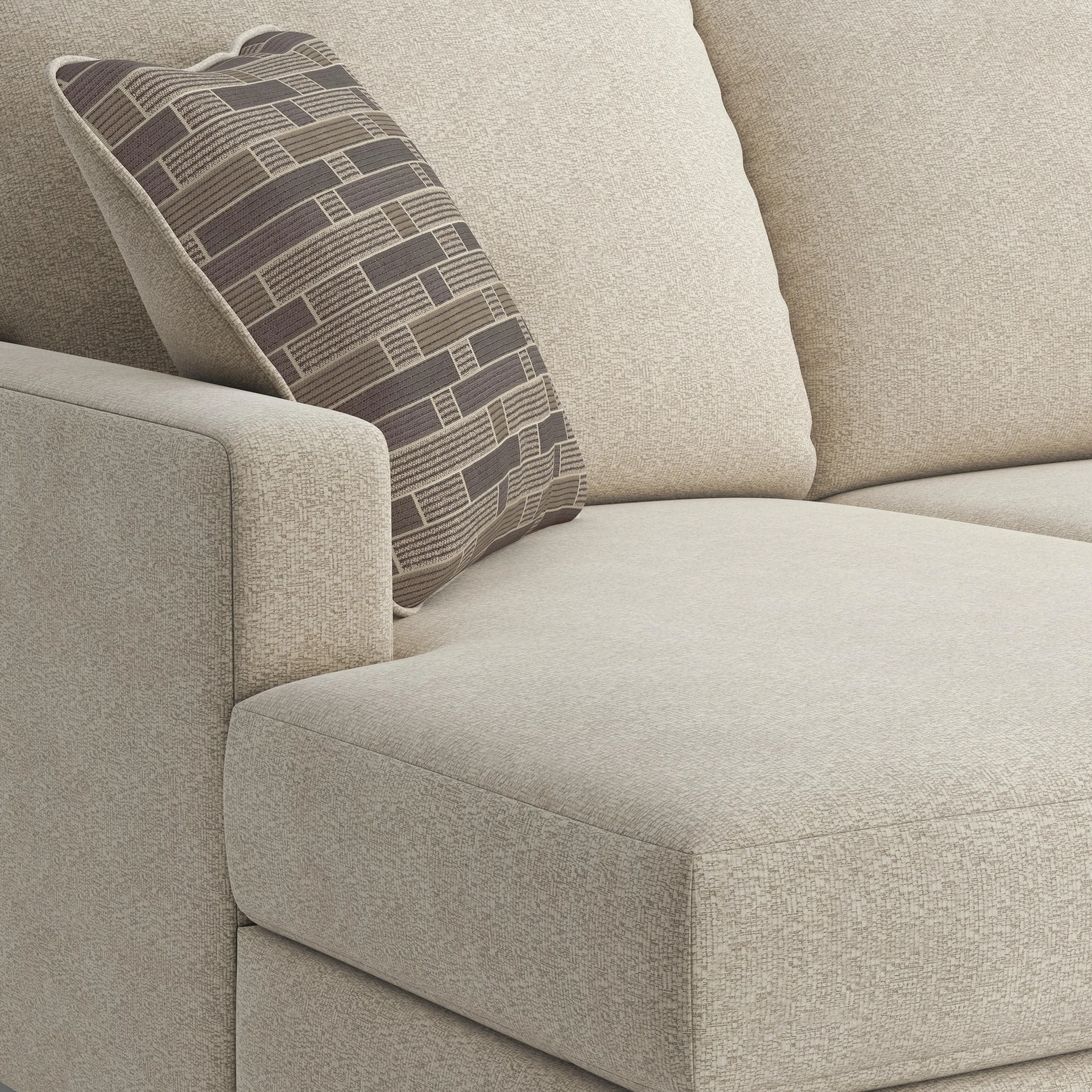 Close-up of the Evergreen sectional showcasing the linen-look upholstery, plush cushions, accent pillows, and quality craftsmanship.