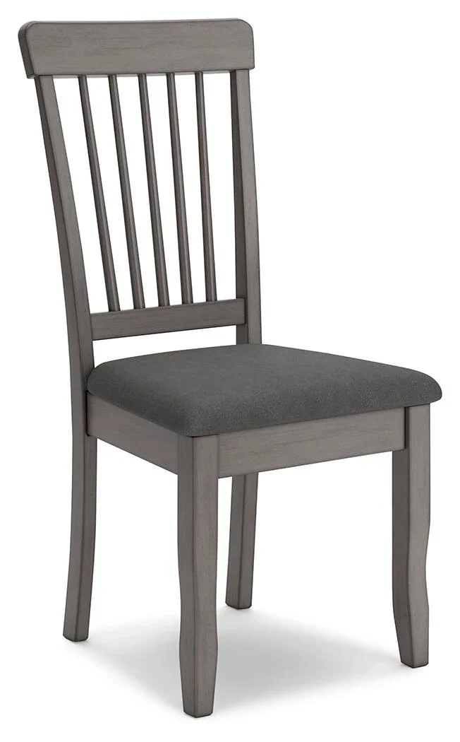 Side angle view of the Stonehill dining set highlighting the grey upholstered dining chairs.