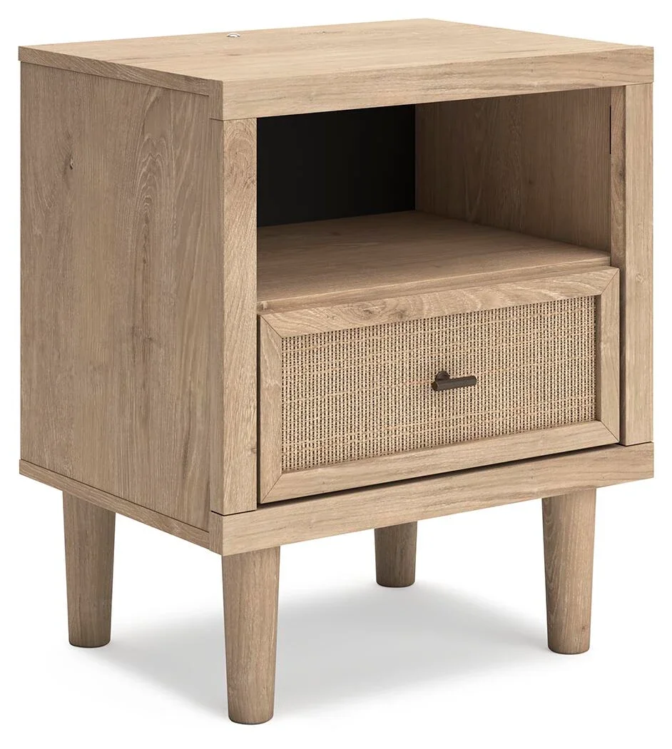Modern one-drawer nightstand with a light oak finish, cane-inspired drawer front, built-in LED lighting, USB ports, and wireless charging.