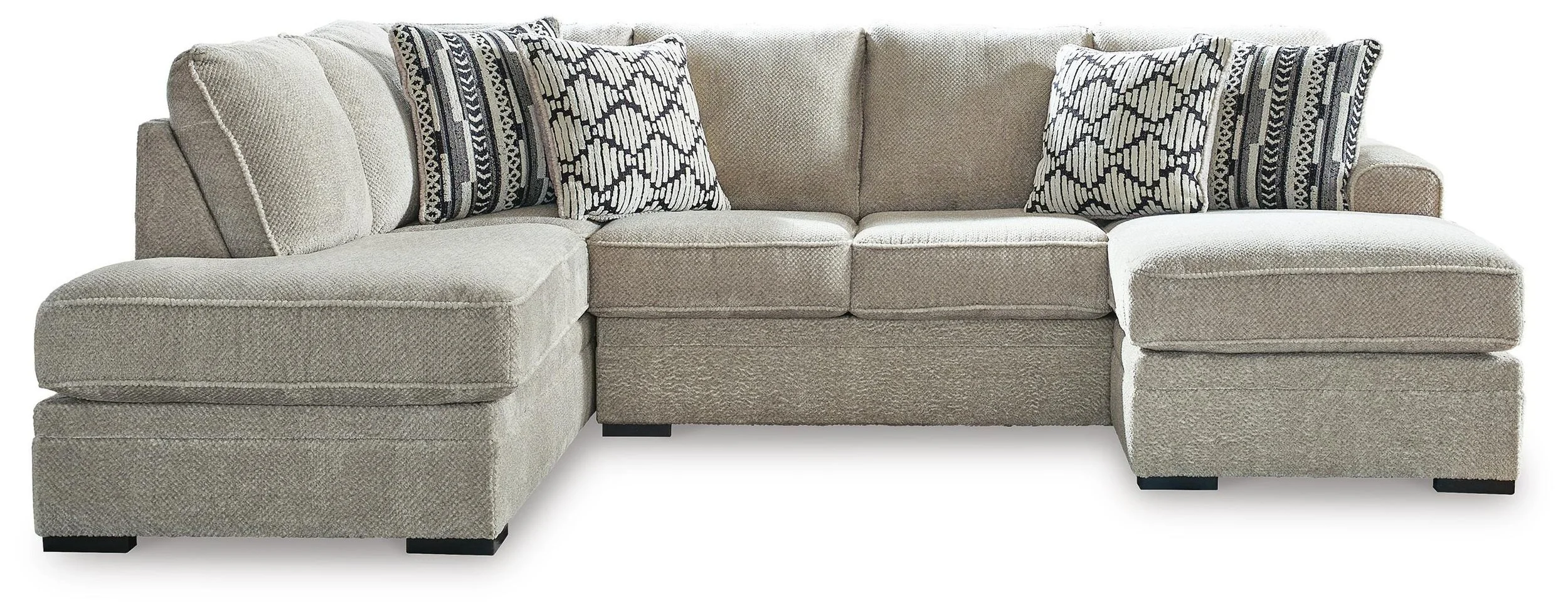 Contemporary dual-chaise sectional with soft polyester upholstery, reversible cushions, plush seating, and coordinating accent pillows.