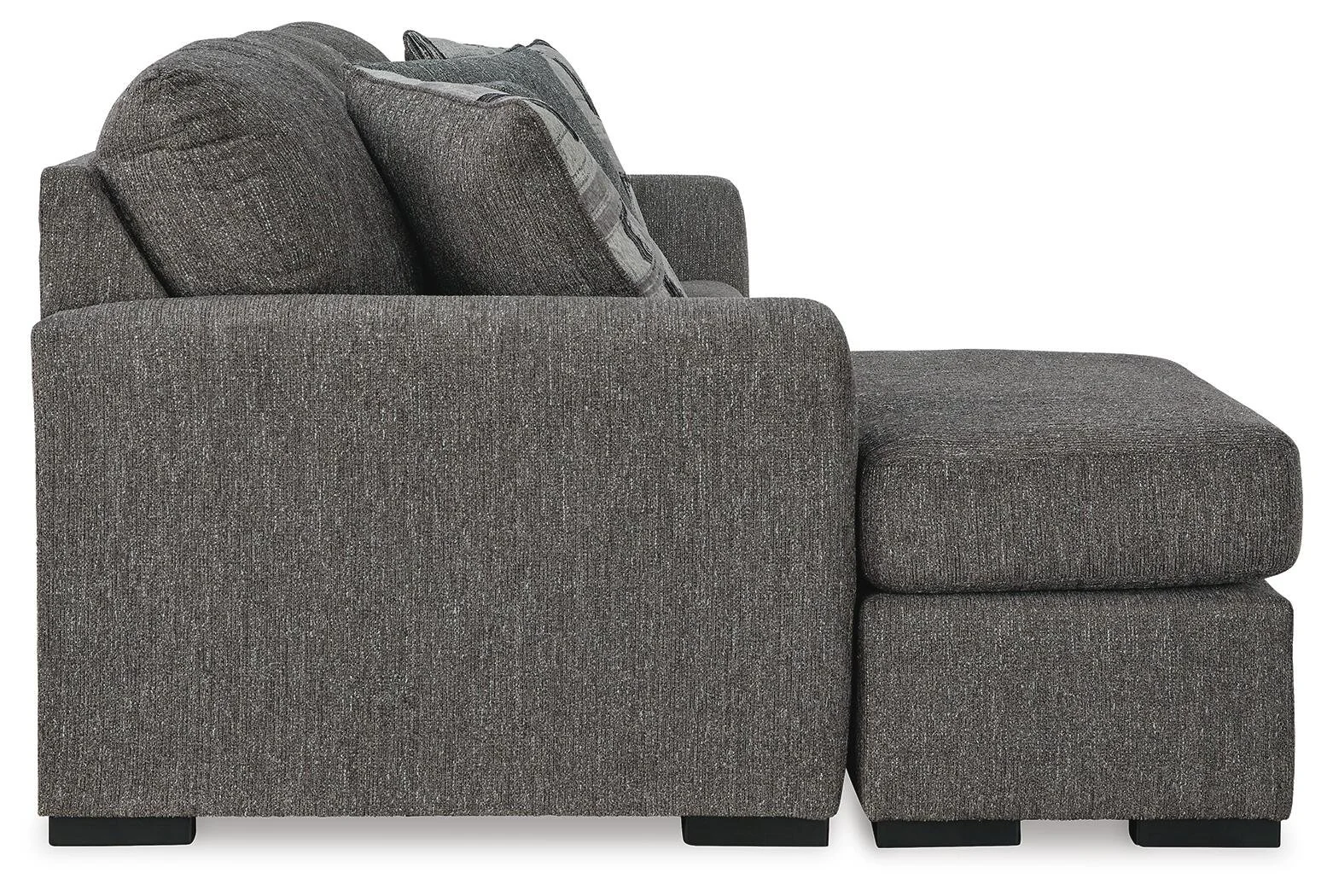 Contemporary reversible sofa chaise with soft polyester upholstery, movable ottoman, plush cushions, and oversized seating.