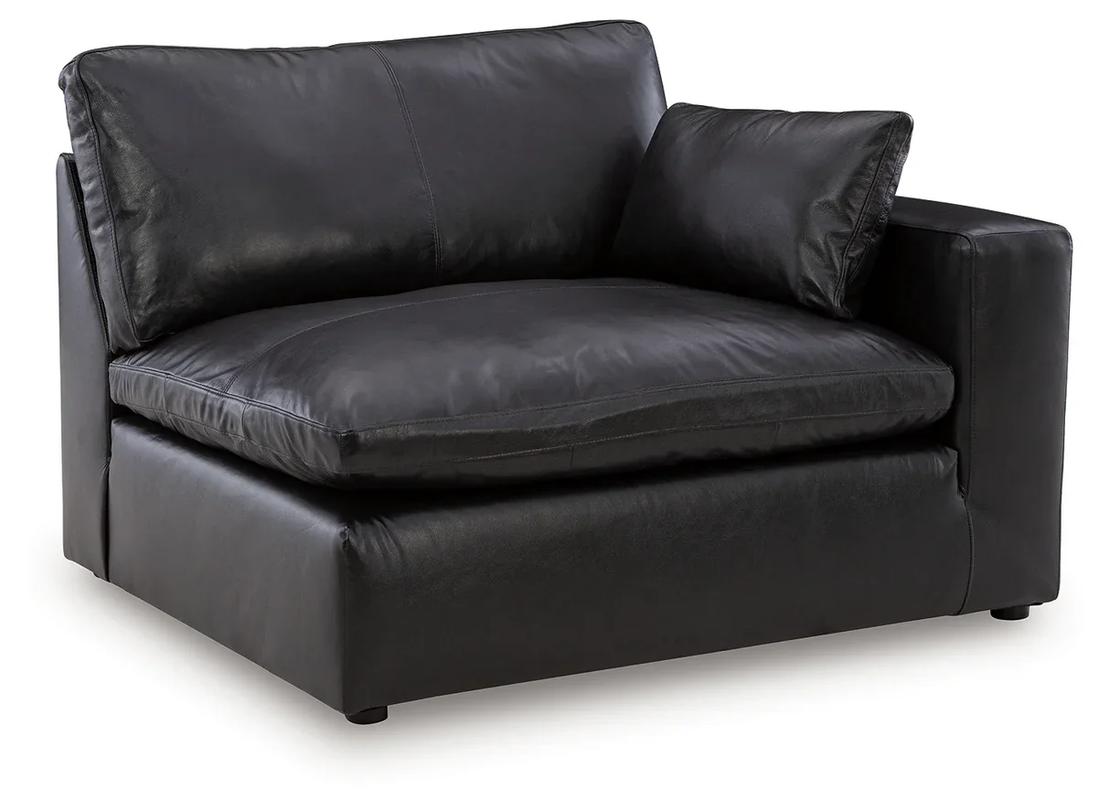 Contemporary modular loveseat with top-grain leather seating, feather-fiber cushions, bolster pillows, and two-piece modular design.