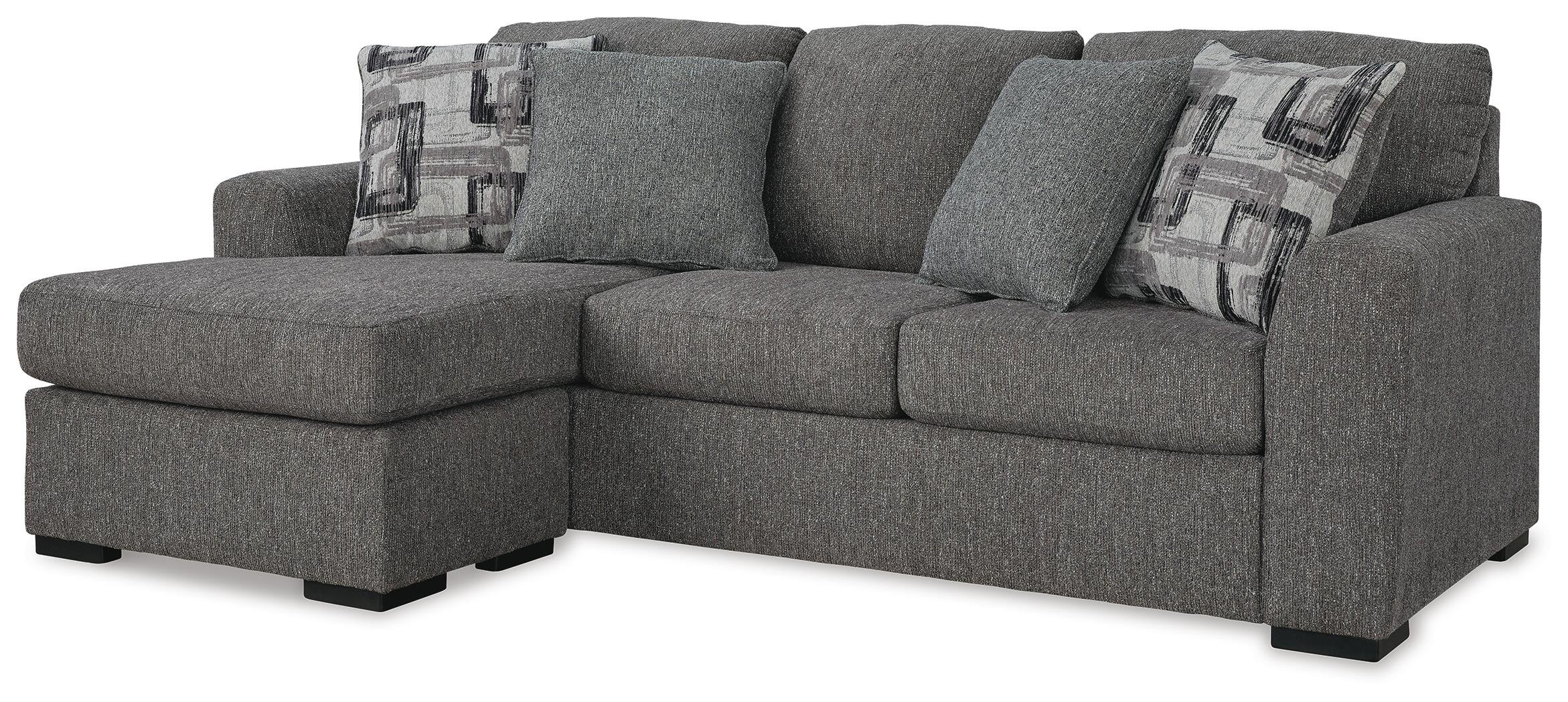 Contemporary reversible sofa chaise with soft polyester upholstery, movable ottoman, plush cushions, and oversized seating.