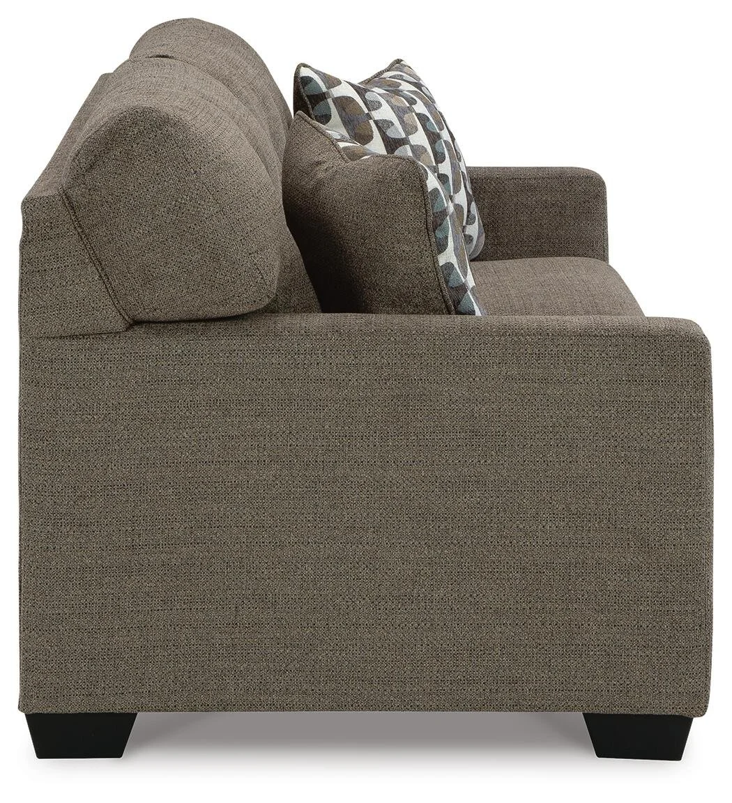 Transitional sofa with tufted back cushions, soft multi-toned polyester upholstery, plush seating, and coordinating accent pillows.